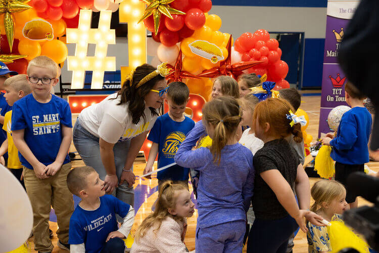 Teacher interacting with a group of students